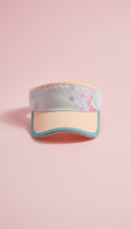 Peach-accented sun shield golf visor